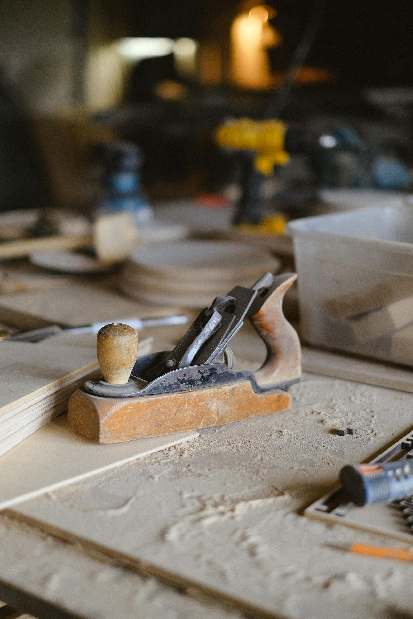 A hand plane resting on the workbench